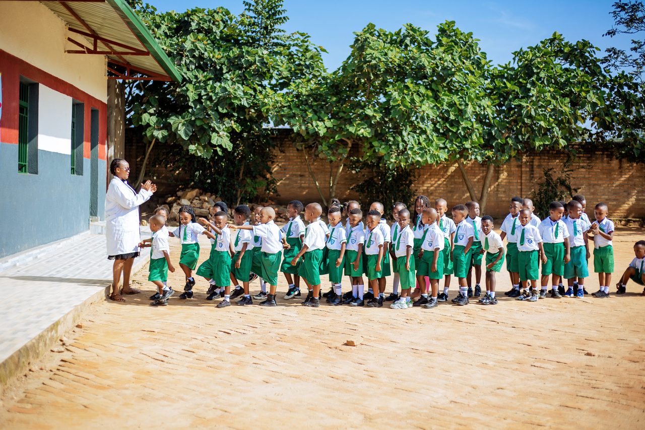Nursery learners lining up with their teacher